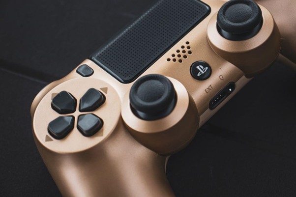 gold PlayStation controller close-up