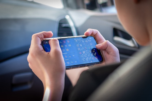 A person playing an online slot-style game on a smartphone
